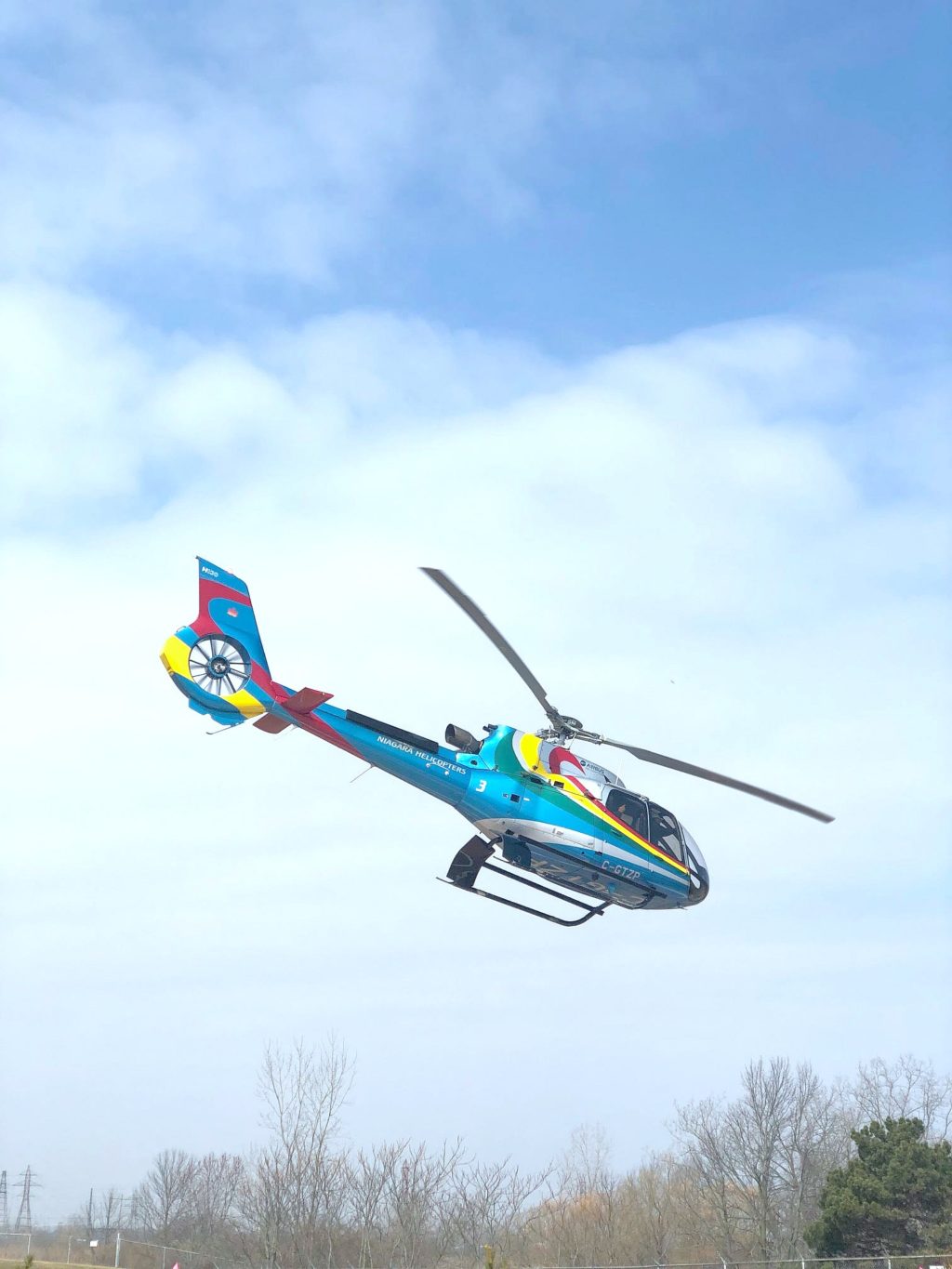 A helicopter takes off from the Niagara Falls Tour launch pad. 