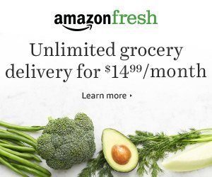 Green vegetables are shown against a white background. Banner reads Amazon Fresh Unlimited Grocery for $14.99.