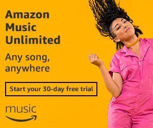 A woman in a pink jumpsuit dances and her hair flows in the wind. Next to her reads Amazon Music Unlimited, try for free.