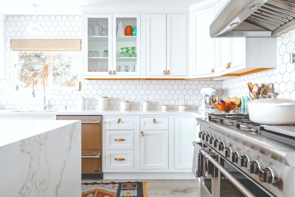 A beautiful kitchen shes the fittings and cabinets that are modern yet rustic. 