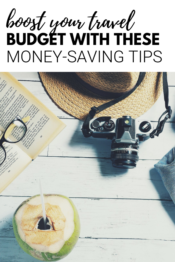 A banner reads, "boost your travel budget with these money-saving tips,' and below is a picture of travel must-haves like a camera, hat, and more.