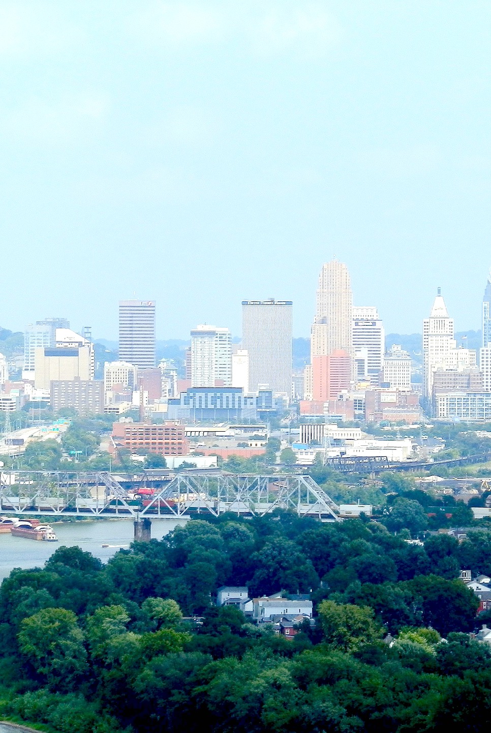 Skyline in Cincinnati, Ohio is shown in the distance and a waterway is in focus. Here's why you plan a trip to Ohio.