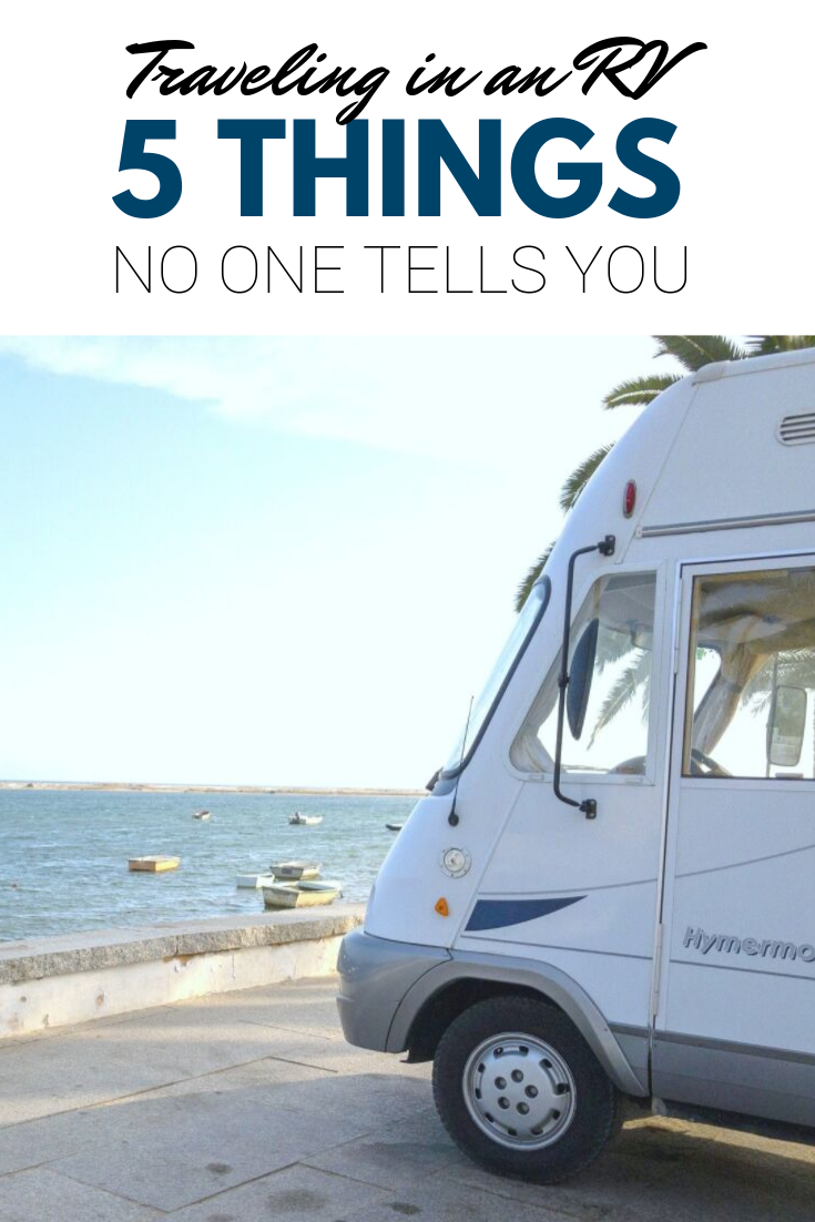 A banner reads, "traveling in an RV, 5 things no one tells you," a tip of an RV is shown parked by a waterfront that is lined by many boats. 