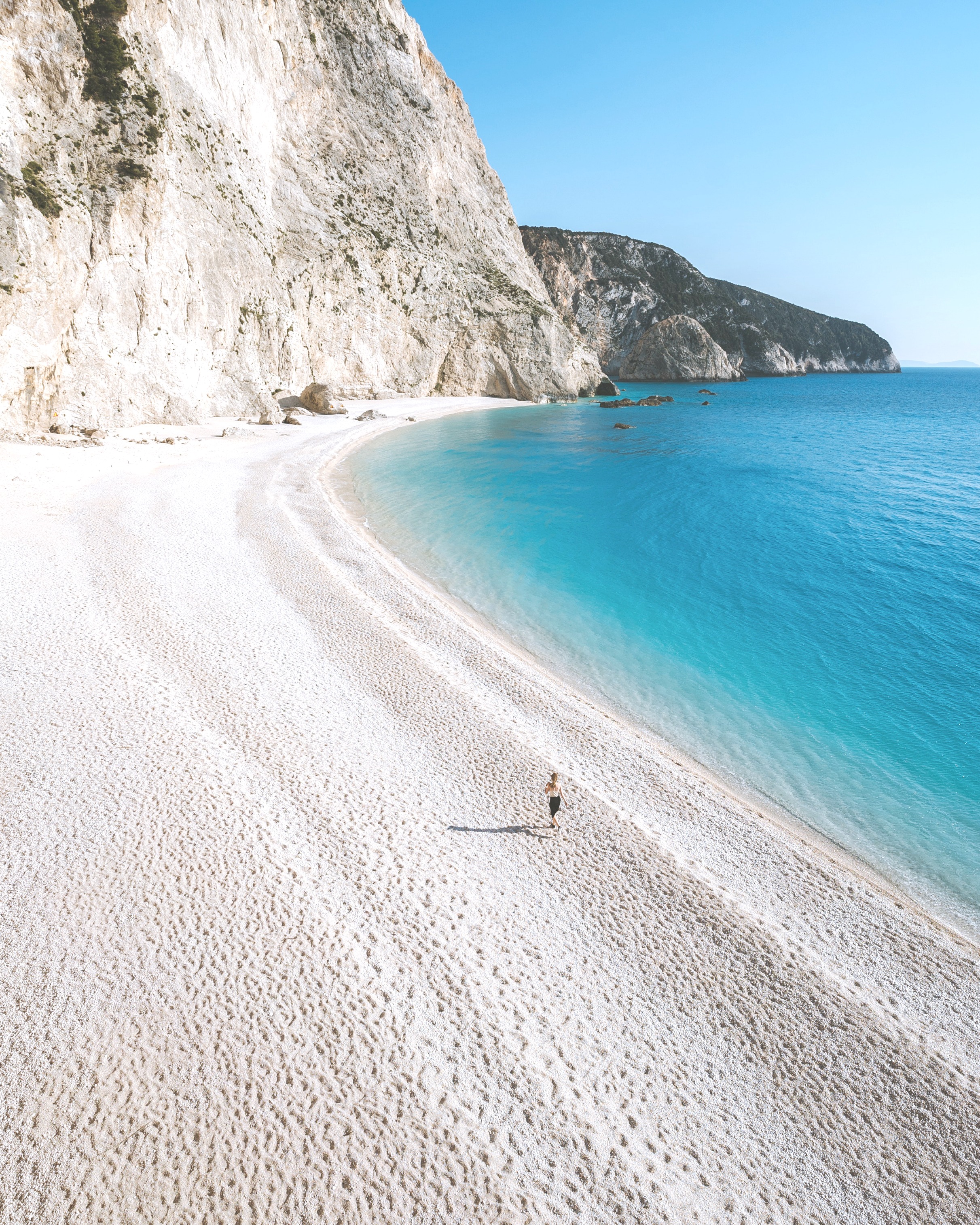 White sand beach in Greece, with turquoise waters. 
