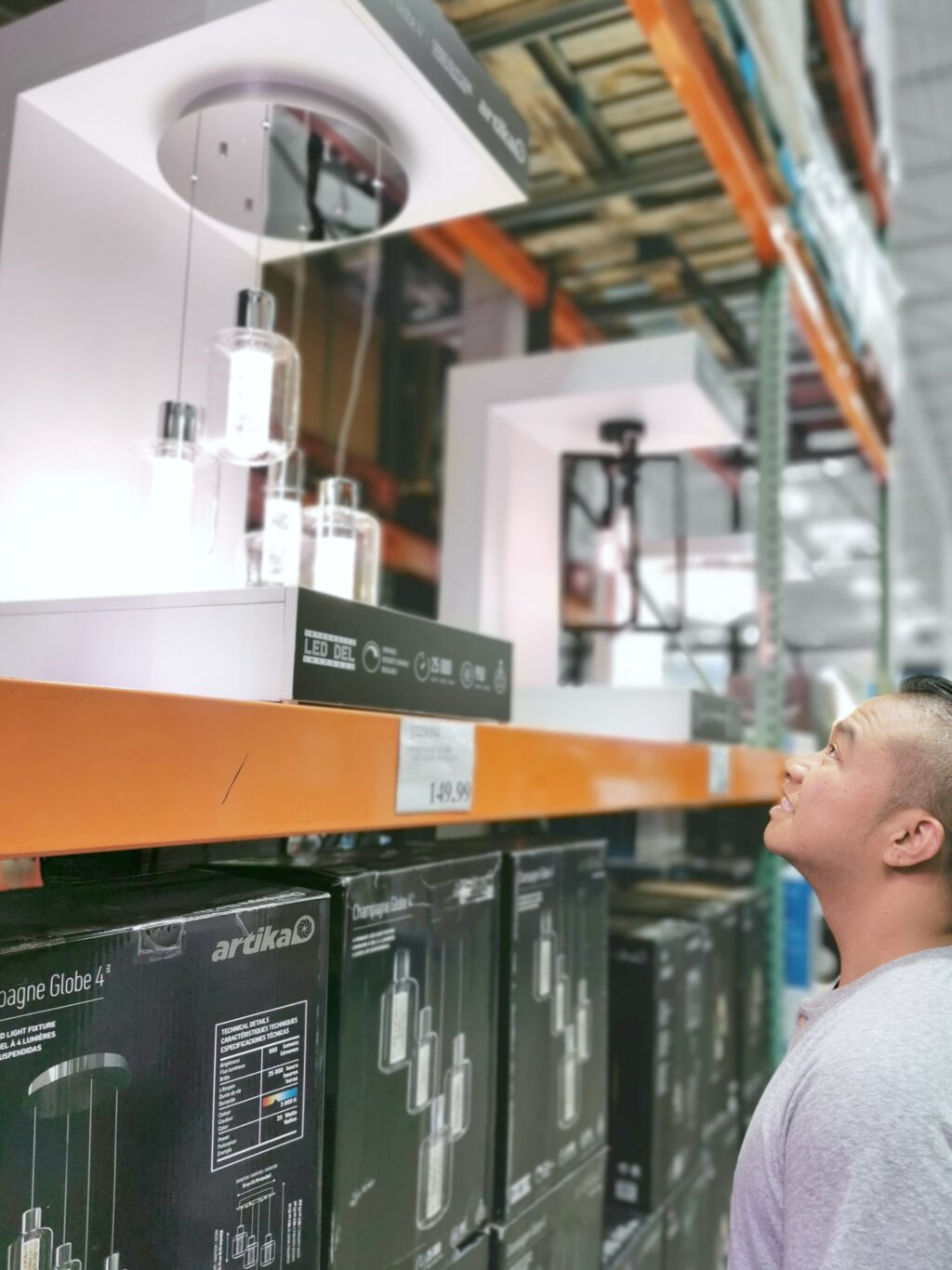 Darasak checks out the lighting and bulbs at Costco.