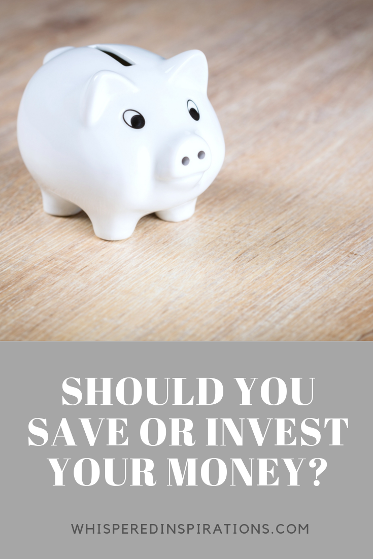 A white piggy bank on a wood table.