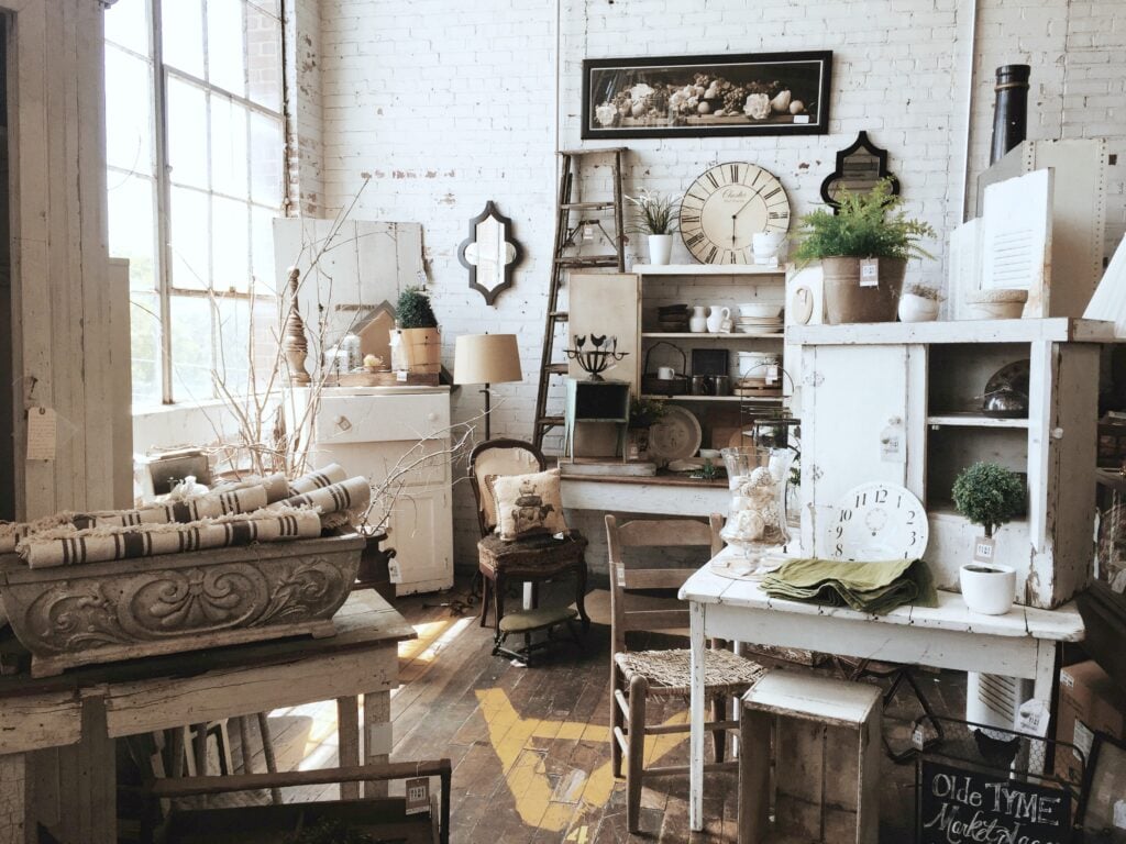 A room full of gorgeous antiques and antique furniture. 