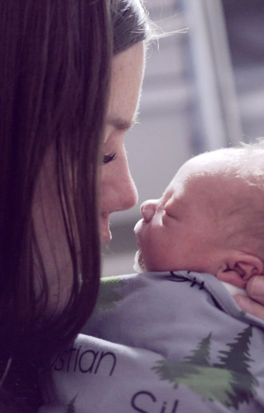 Mother and child embrace after birth and labour. This article shares how to heal after a traumatic birth experience.