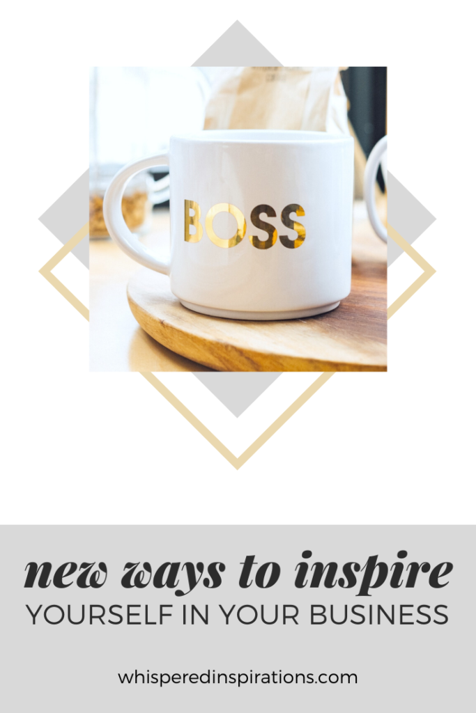 A banner reads, "new ways to inspire yourself in your business." A mug that says Boss, on wooden tray on a kitchen table.