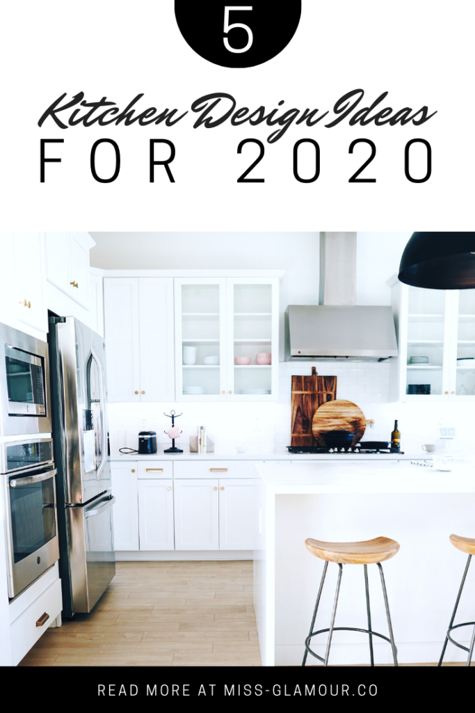 A white kitchen with black fixtures and natural wood stools. A suggestion for some kitchen design ideas for 2020.
