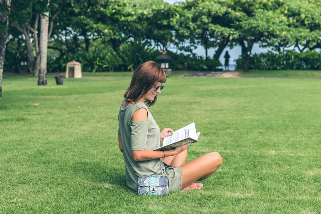 An older woman sits on a lawn reading a book and studying.

There are many reasons why you may think about going back to school. Like stability and securing a better future for your family. Use these tips! #tips