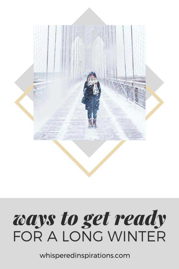 A girl stands and smiles on the NYC bridge. It's a cold, windy, winter wonderland. A banner reads, "wasy to get ready for a long winter."