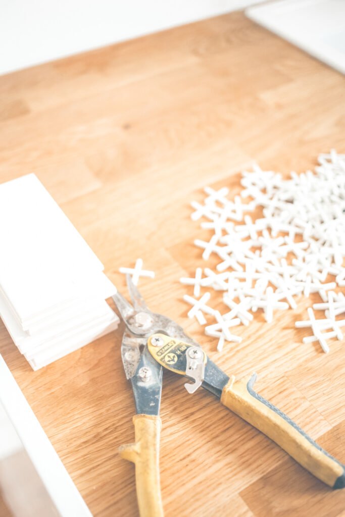 A table with tiling supplies and tools.