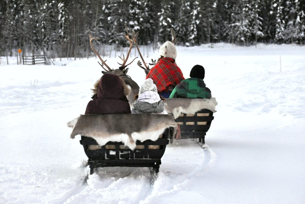 People on a sleigh ride in Lapland. 