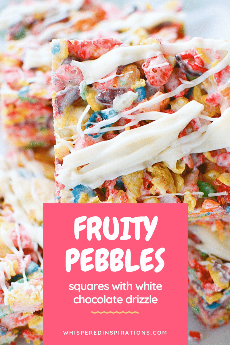 A close up of Fruity Pebbles squares drizzled with white chocolate. A banner reads, Fruity Pebbles squares with white chocolate." A moving sticker that says, click here is on the bottom right corner. 