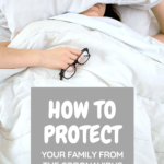 A woman is sick in bed. She is covering her head with a pillow, under her blanket, and is holding her glasses. A banner reads, "How to Protect Your Family from the Coronavirus."
