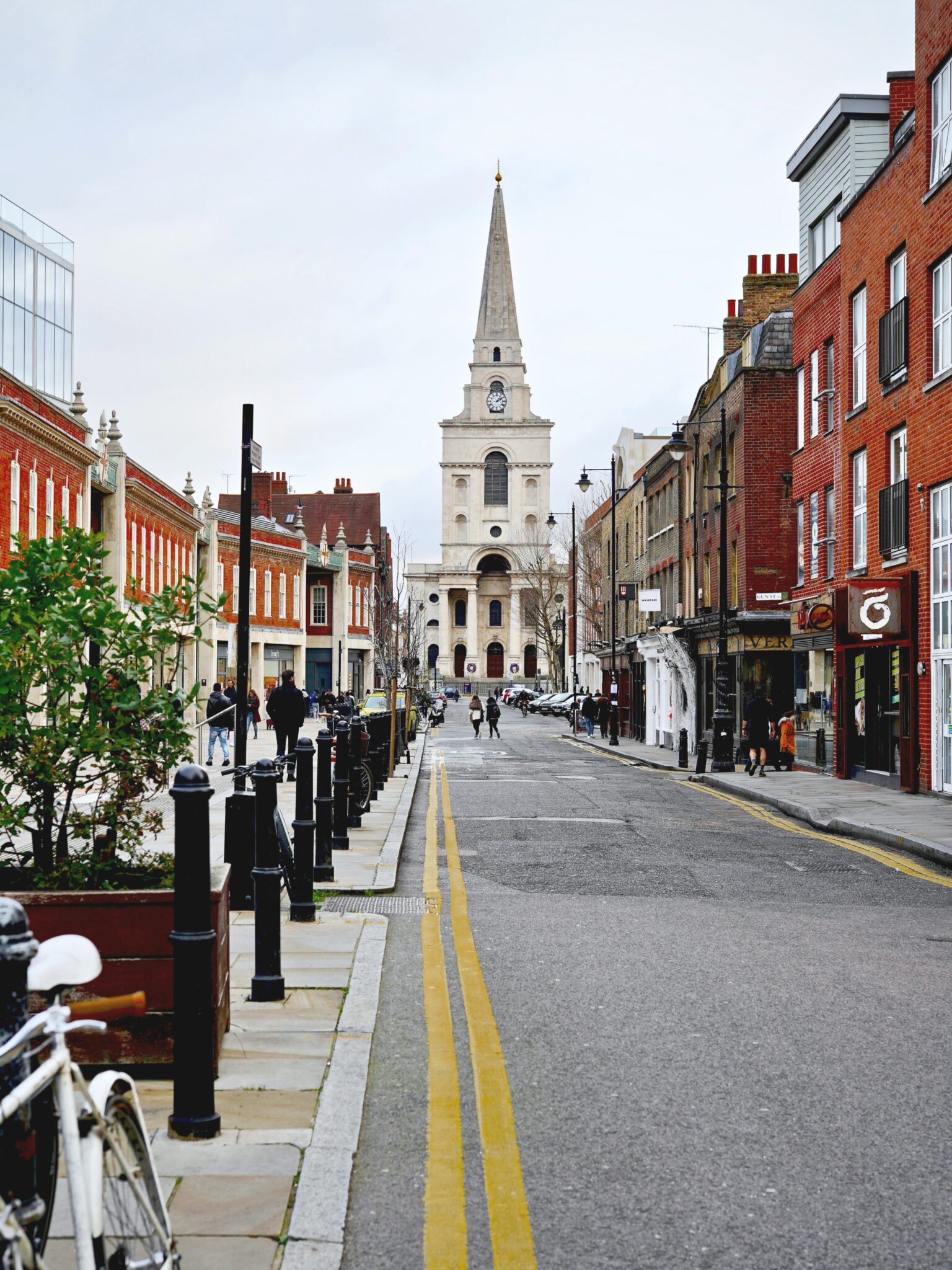 An empty London, England street. Shows a beautiful church and historical buildings. 