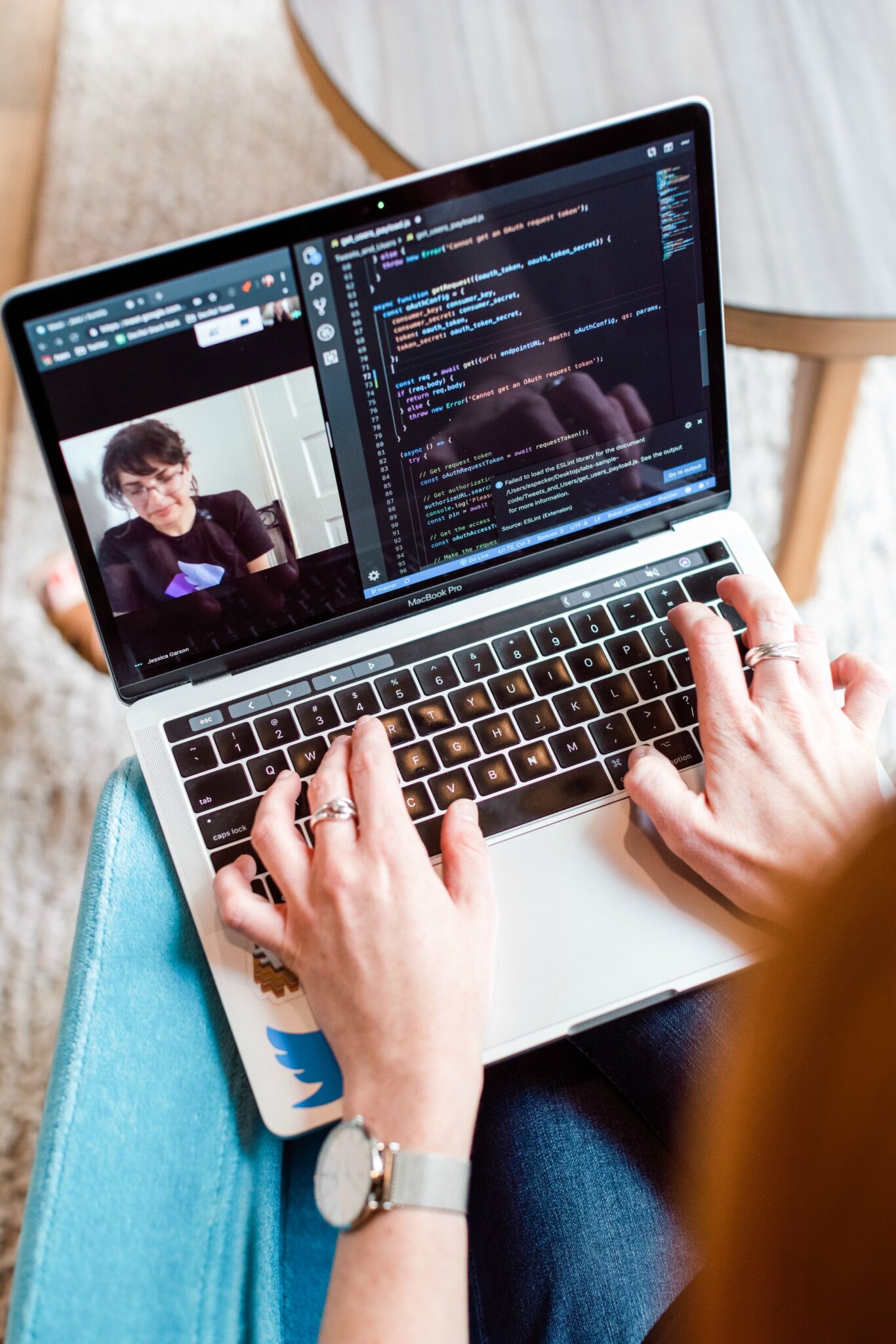 Woman sitting in a chair at home, video chatting, and working from home. 