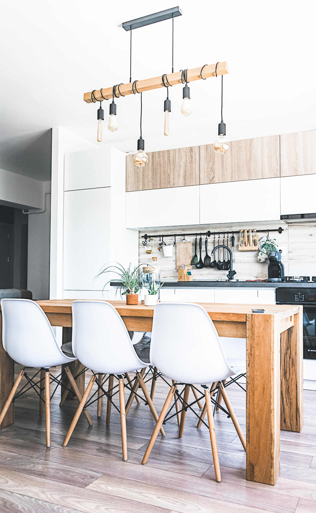 A beautiful modern farmhouse kitchen with white, brown, and grey accents. 