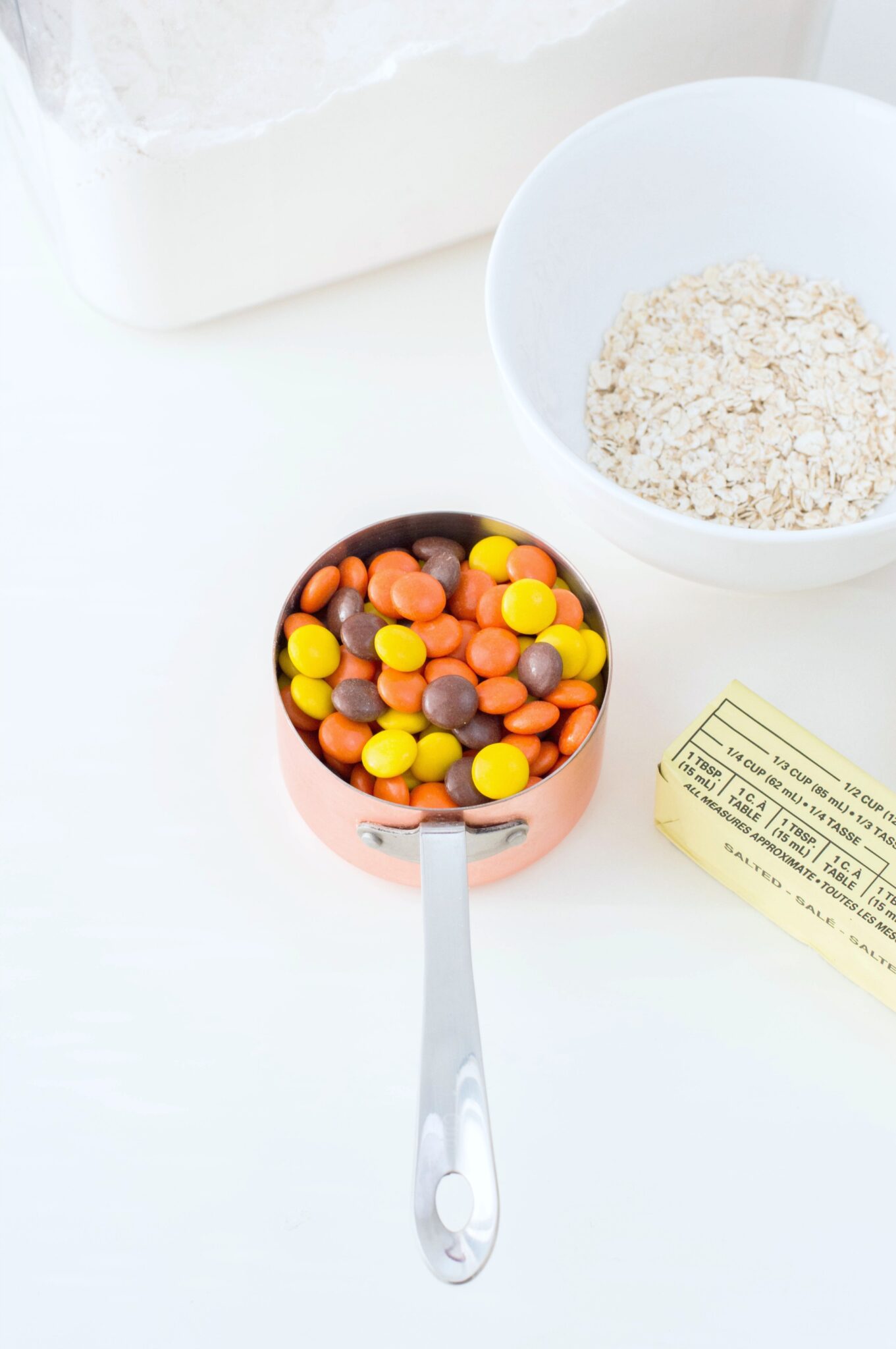 A cup of Reese's Pieces is shown with other ingredients. 