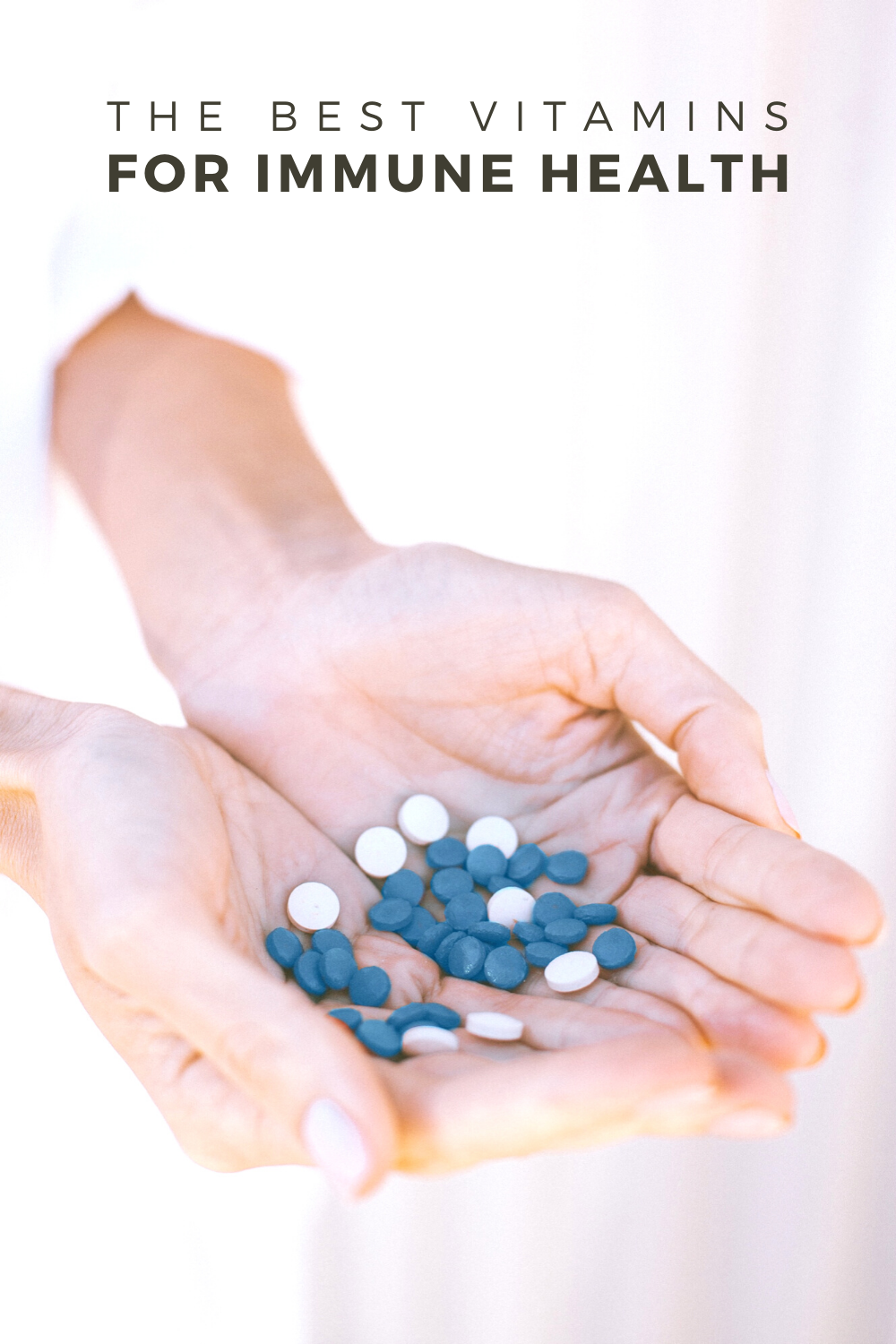 A woman's hand are shown holding handfuls of blue vitamins. A banner reads, 'The best vitamins for immune health.'