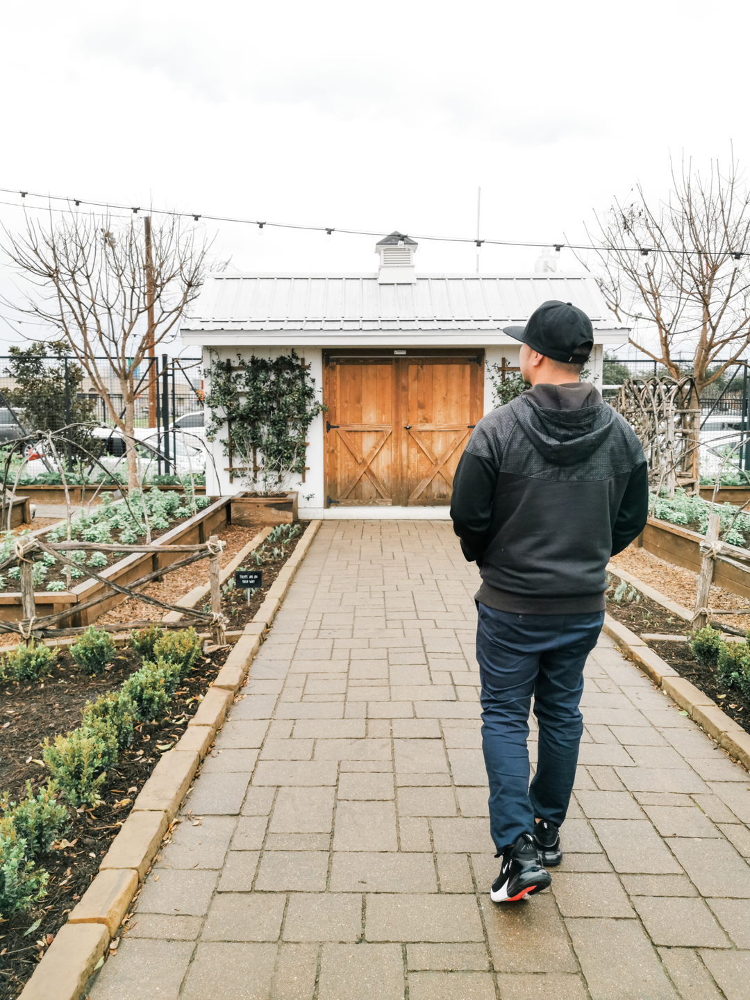 Darasak walking in Magnolia Market.