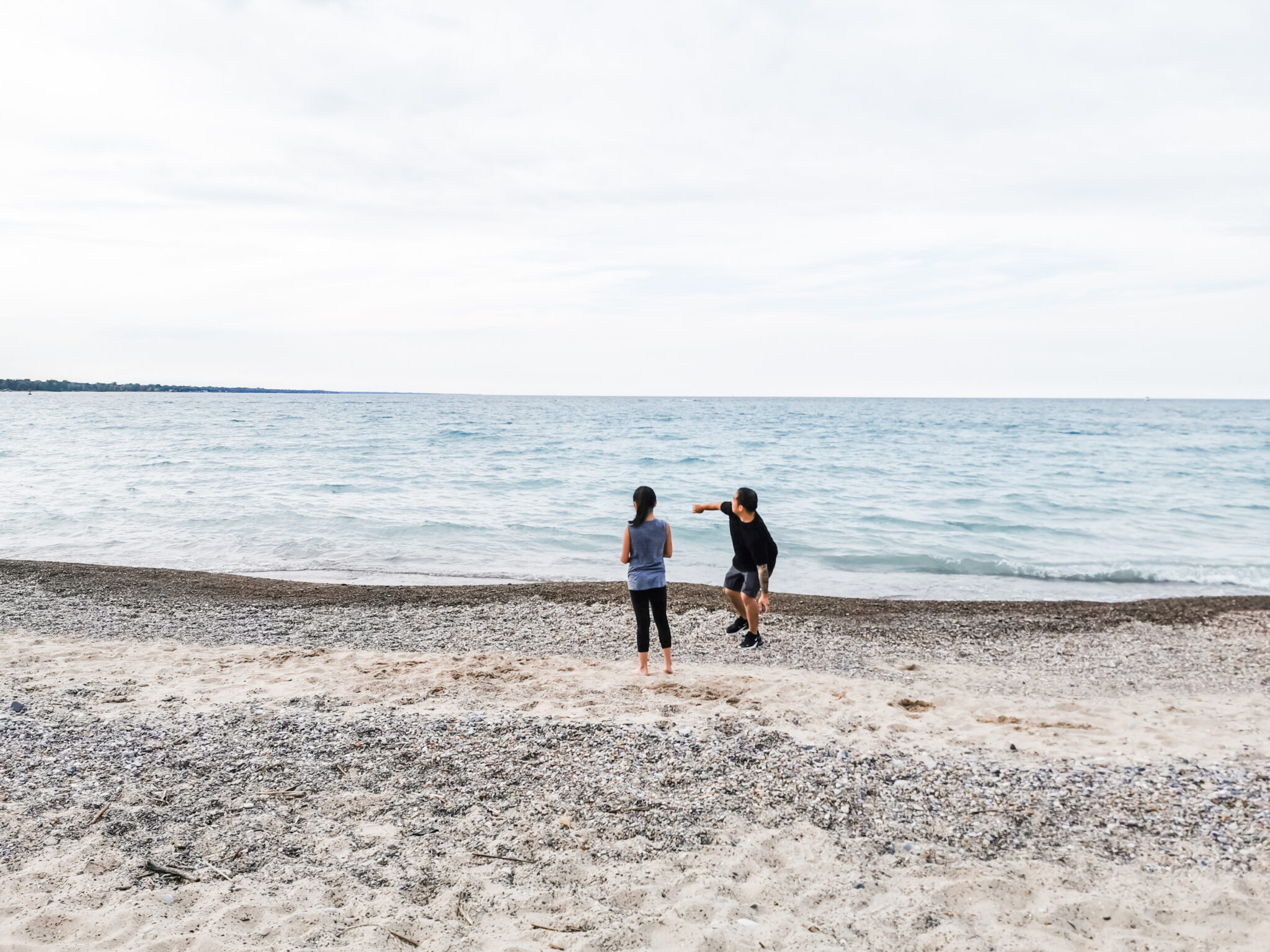 Darasak and Mimi on the beach, skipping rocks. Roadtrippin' with ProClip USA Jeep Accessories. 