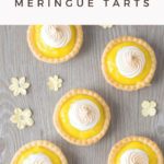 A banner reads, "Mini Lemon Meringue Tarts," a picture below is a a flat lay picture of the tarts on a grey board.