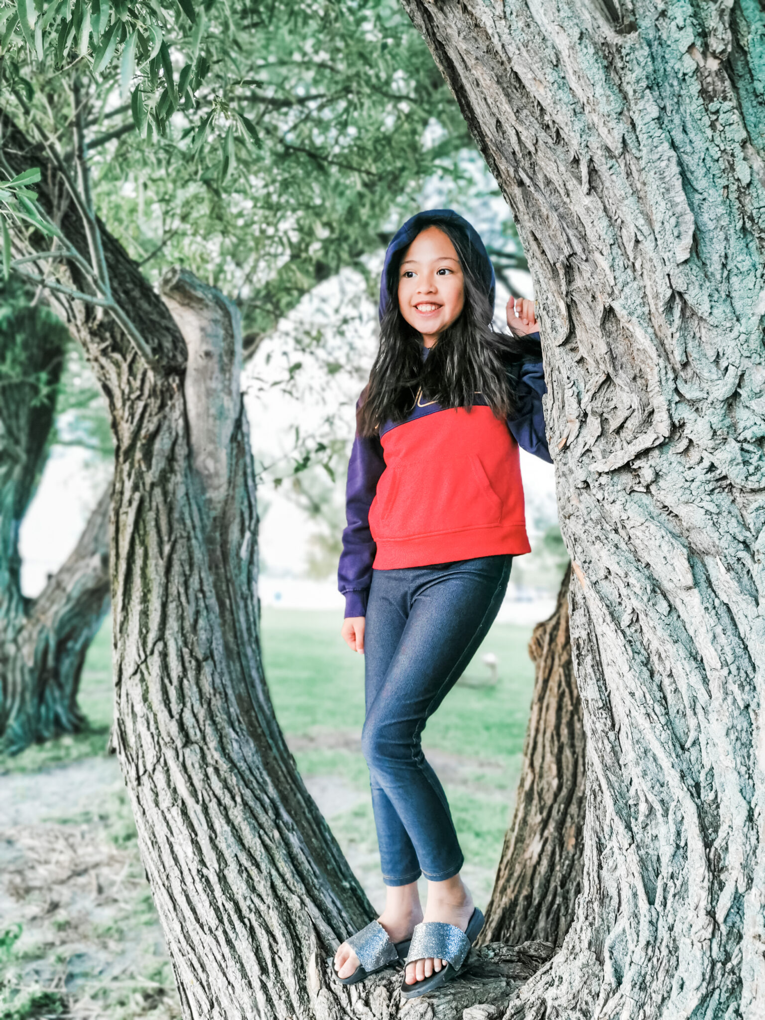 Mimi standing in a tree. After an amazing road trip in Sarnia, ON.