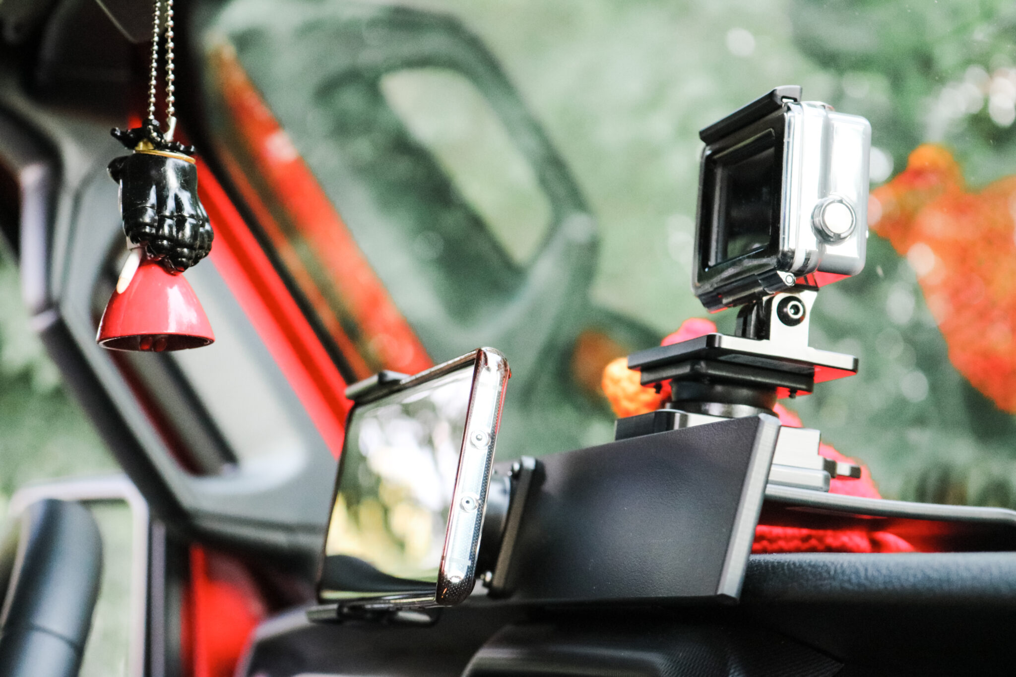 A close up of the ProClip Center Dash Mount, with a standard phone holder, and GoPro Adapter. One of many ProClip USA Jeep Accessories. 