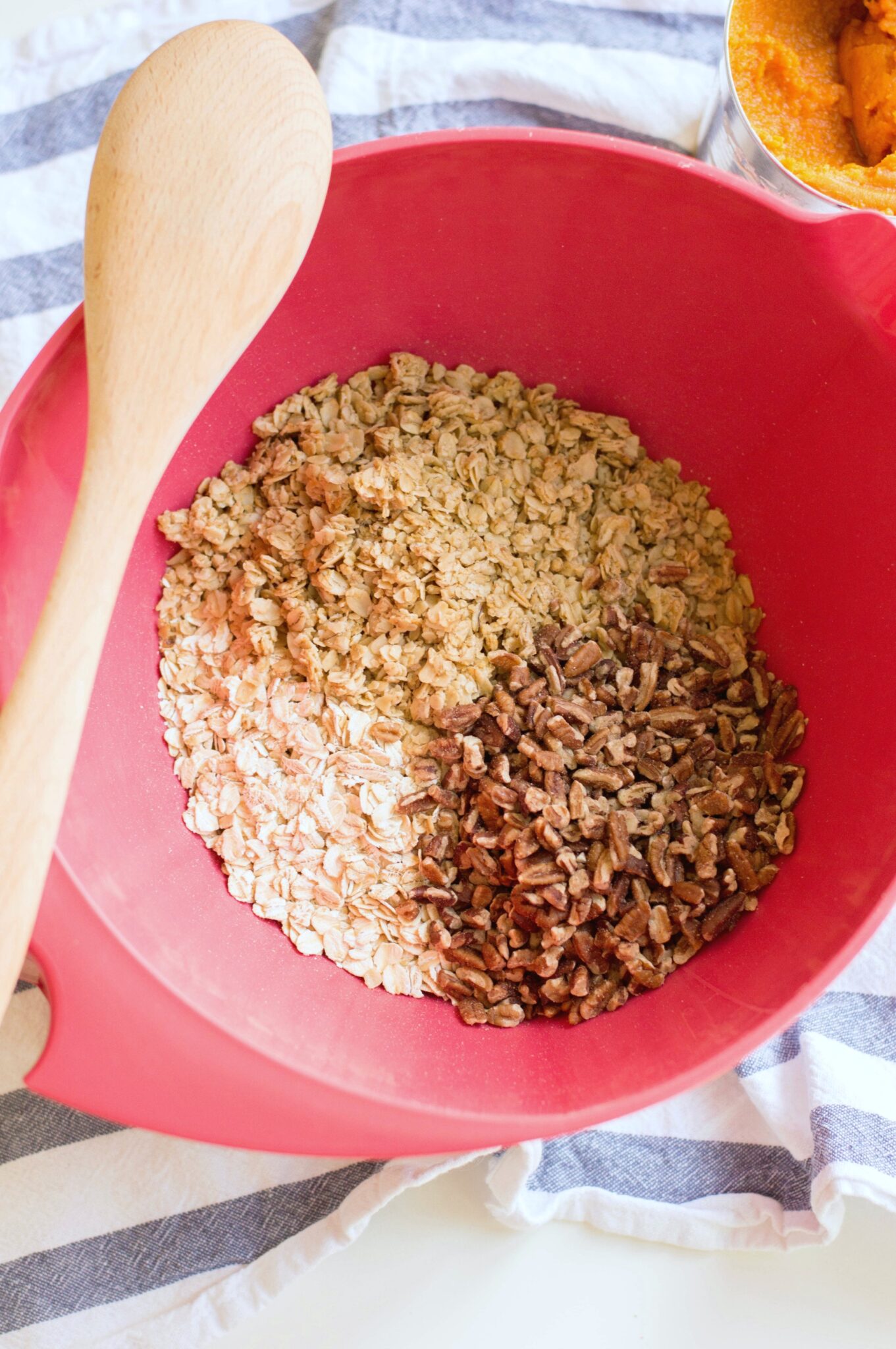 Bowl of dry ingredients for Pumpkin Maple Pecan granola. 