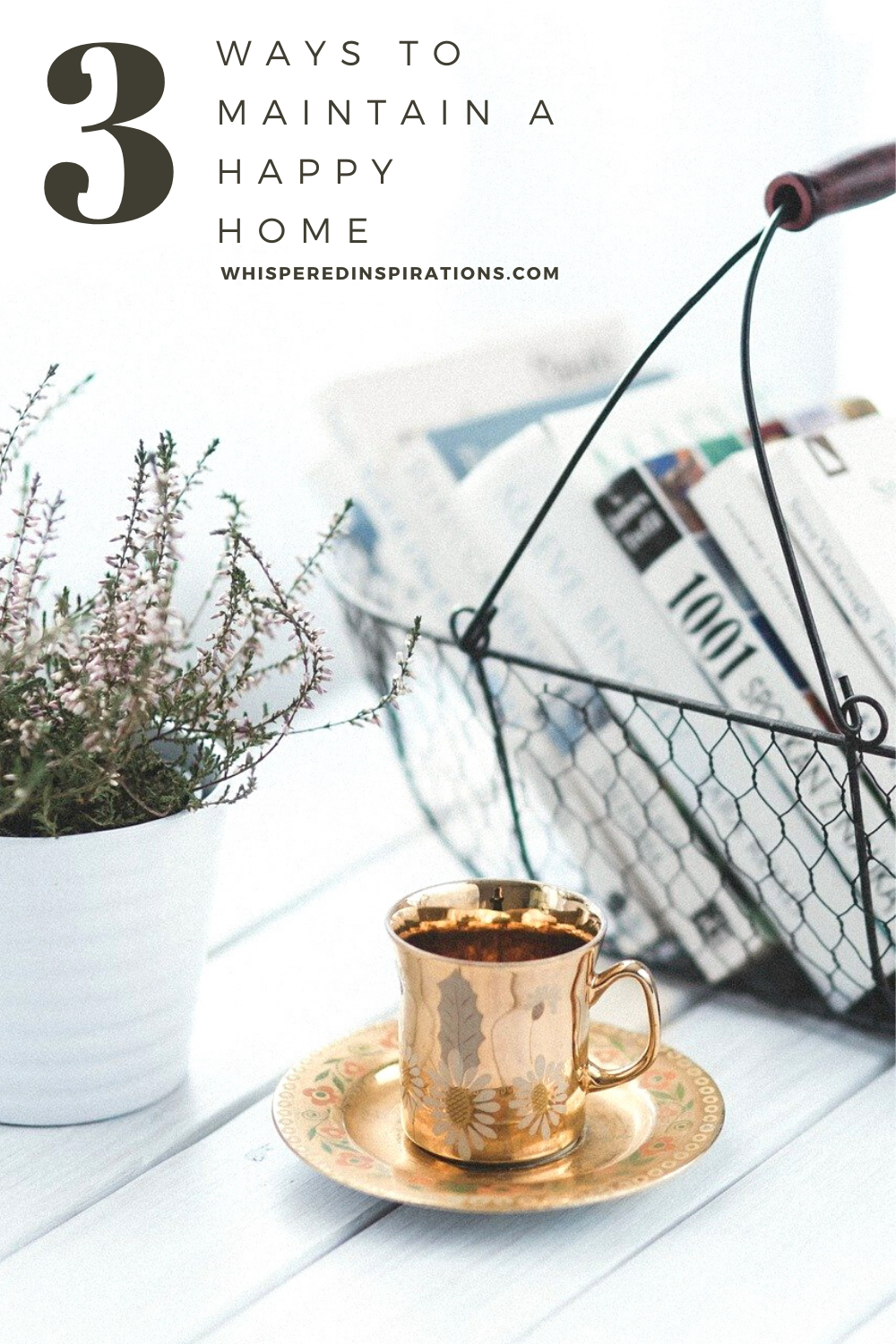 A basket filled with books on a white table. A gold mug and dish and flowers also sit on the table. Just an example of the ABCs of maintaining a happy home.