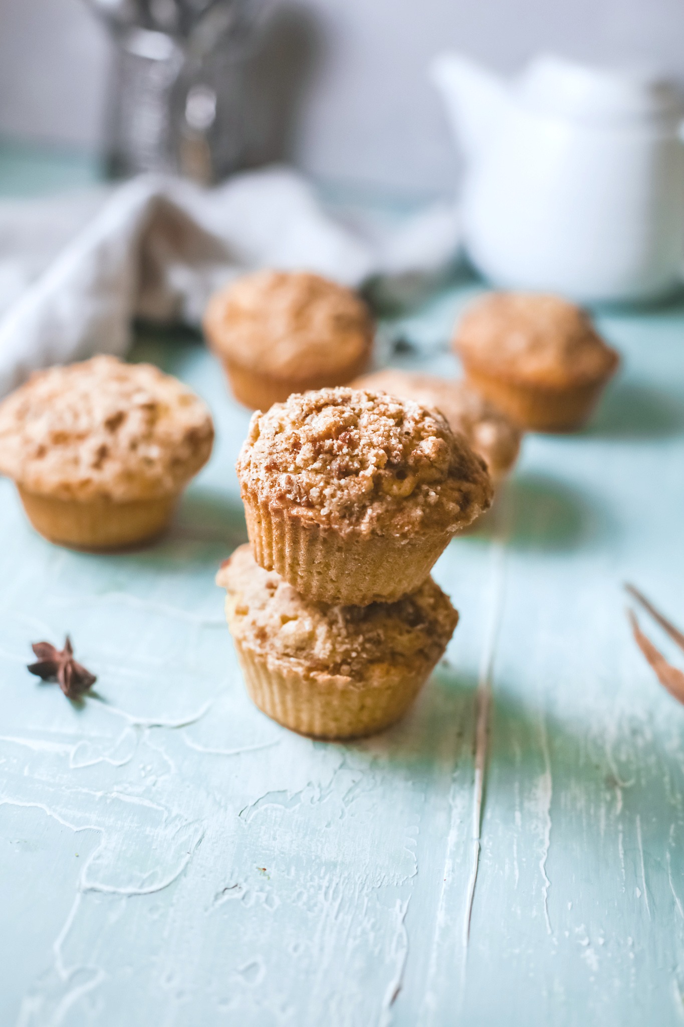 Pumpkin Streusel Muffins, a stack of two, and 4 behind it.