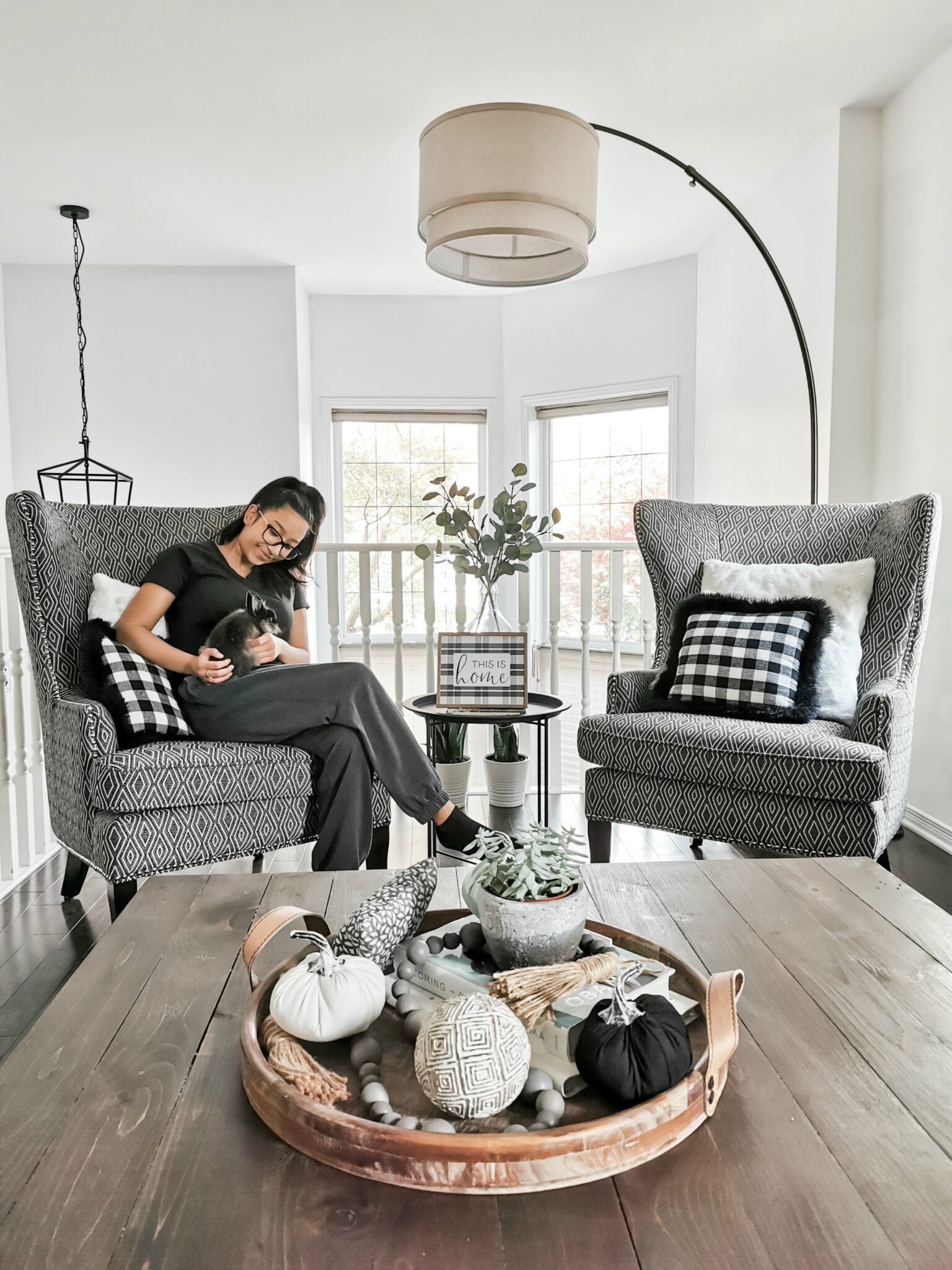 Gabby sits in our living room holding our new bunny Nori. We are counting our blessings with a list of 20 things I am thankful for. 