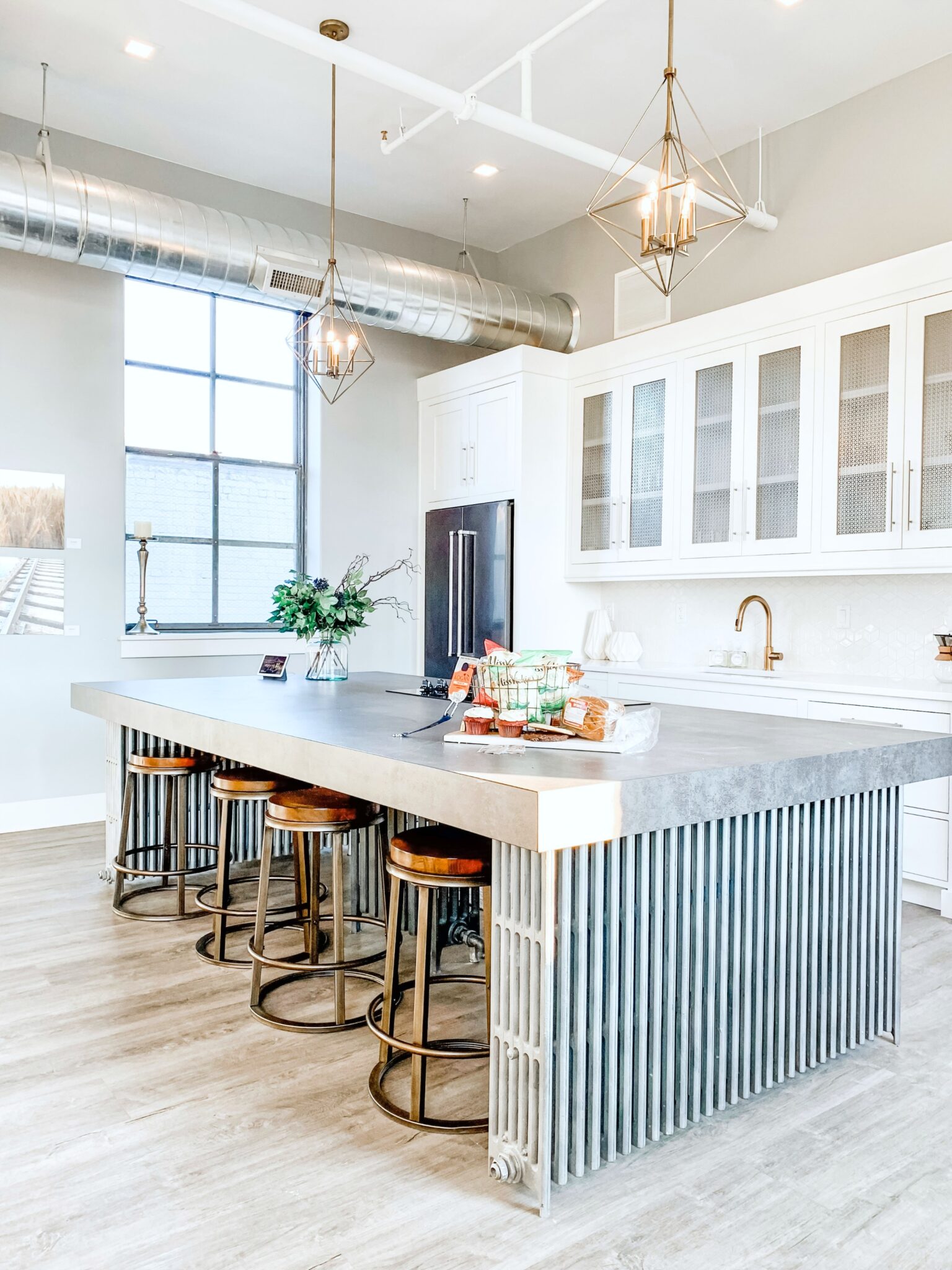 A recently remodelled kitchen that is industrial and modern.