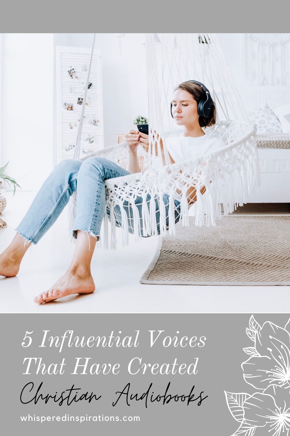 A woman in a bright white room with macramé sits in a macramé swing, listening to something on her phone with headphones.