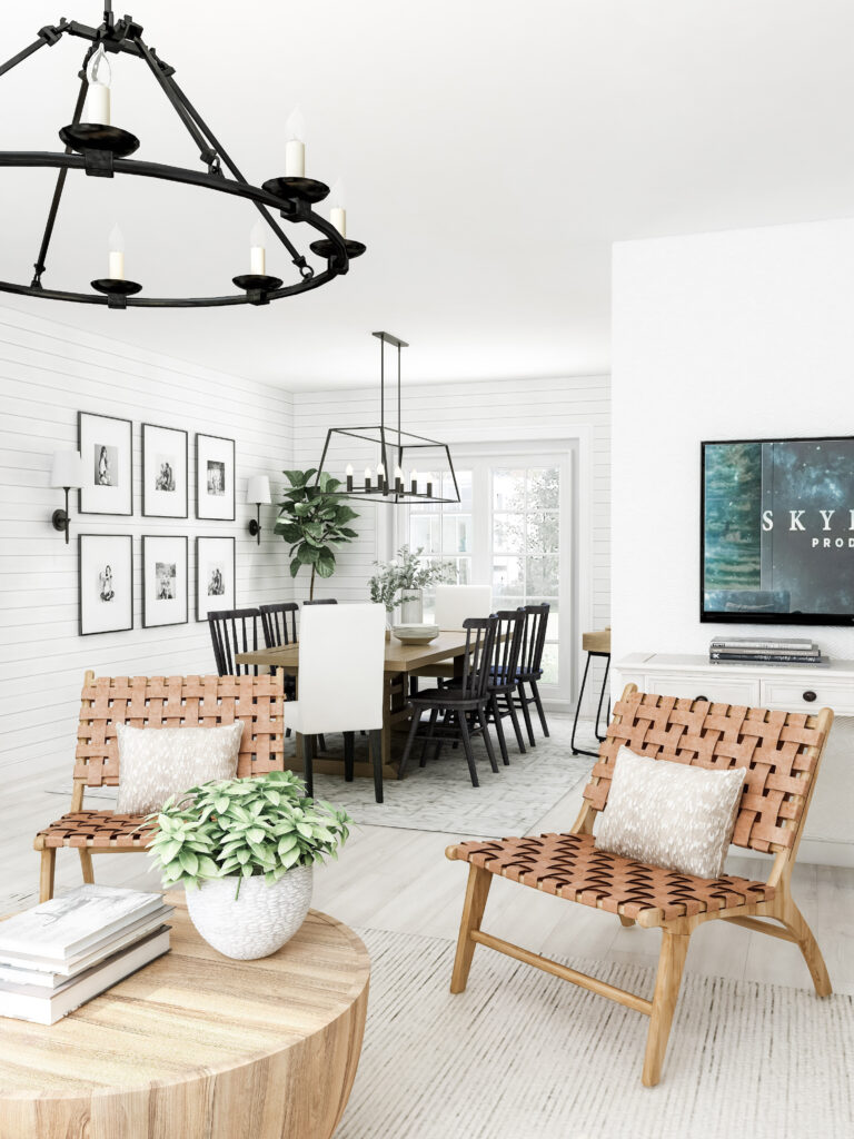 A beautiful farmhouse home. Styled with whites and warm neutrals. A sitting area and dining room are shown with metal chandeliers hang above each area.