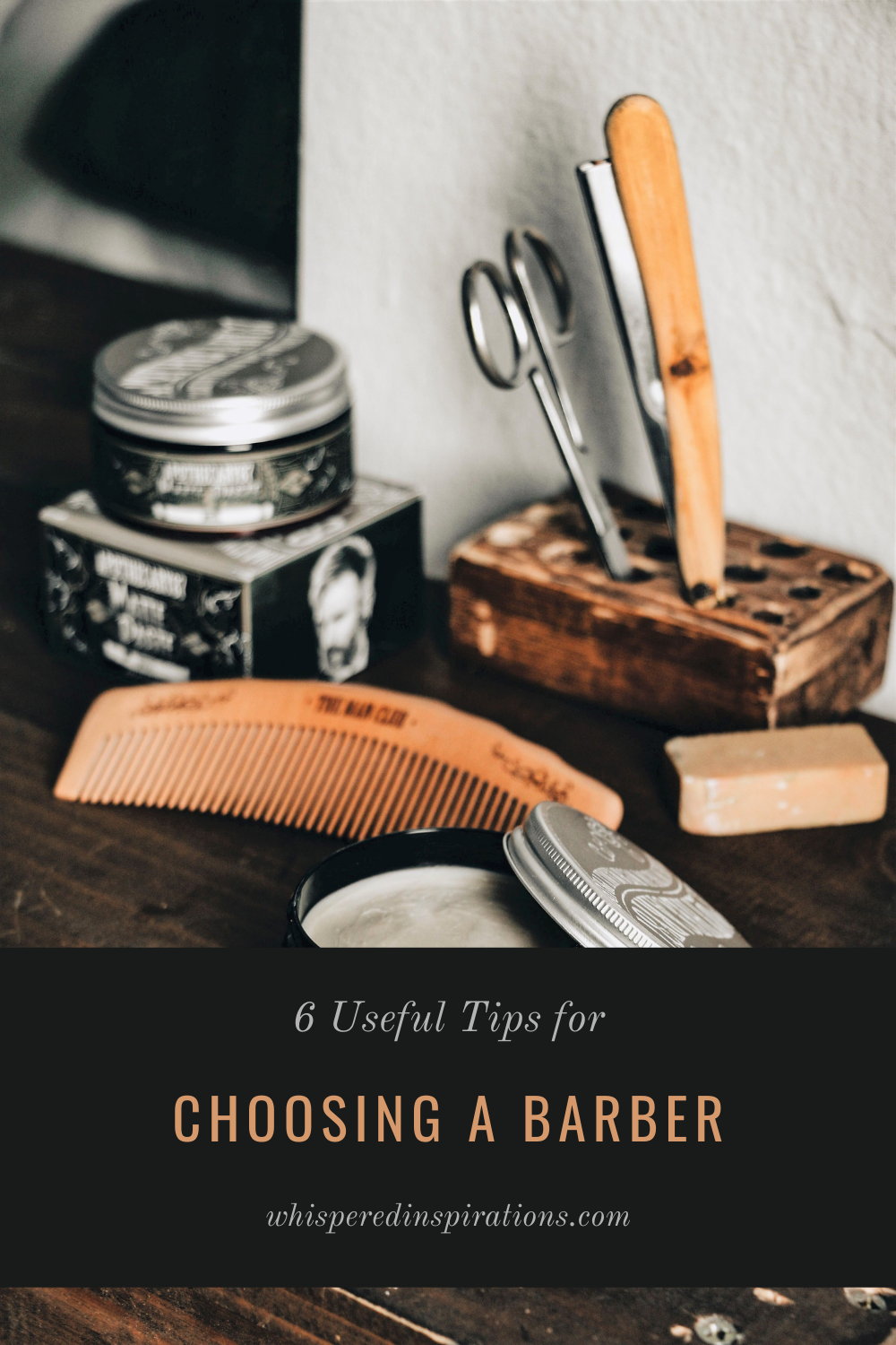 Tools of a barber are shown on a wooden table. Thera are scissors, pomade, brushes, and more. This article covers useful tips for choosing a barber.