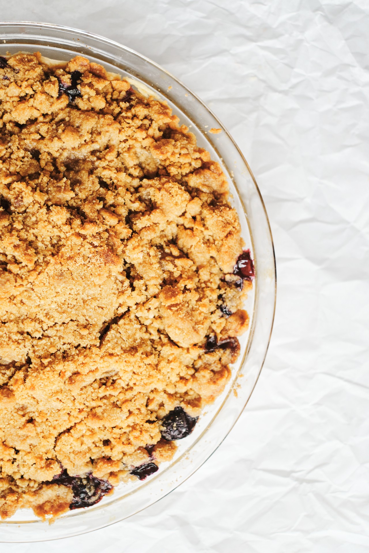 Blueberry Crumble Pie is baked and is shown close up.