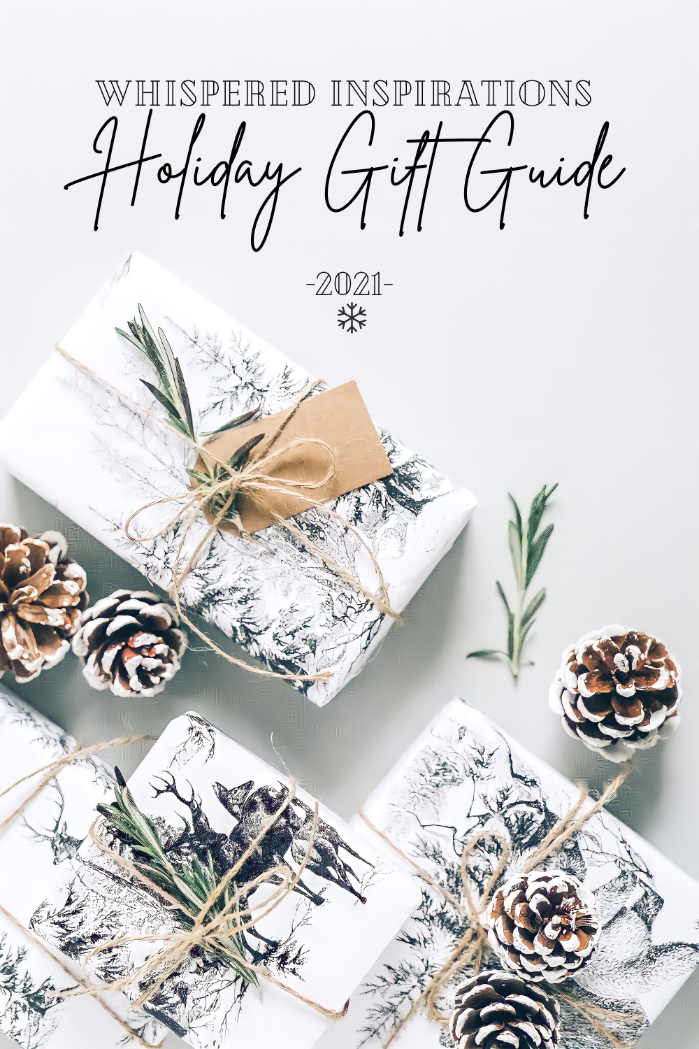 Beautiful gifts are wrapped in black and white wrapping with printed landscape. They are adorned with acorns and greenery and tied with twine. A banner reads, "Whispered Inspirations, Holiday Gift Guide, 2021.