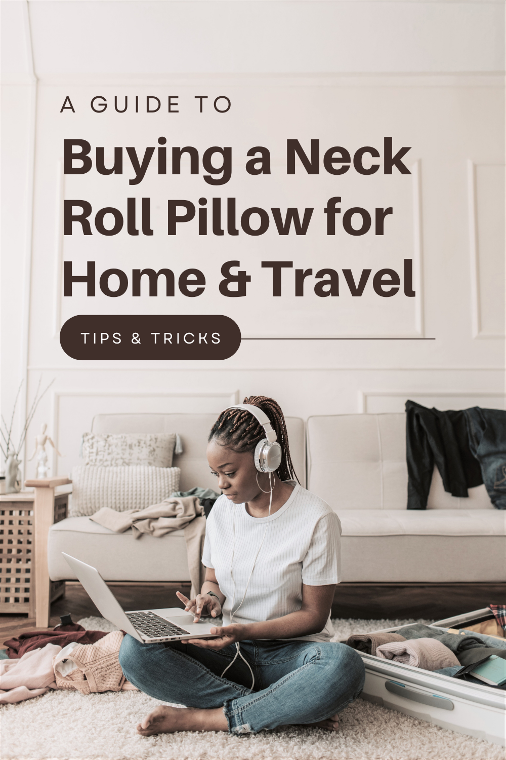 A woman sits in the living room on her laptop, surrounding her are clothes that she is packing away into a suitcase. This article offers a guide to buying a neck roll pillow for home and travel.