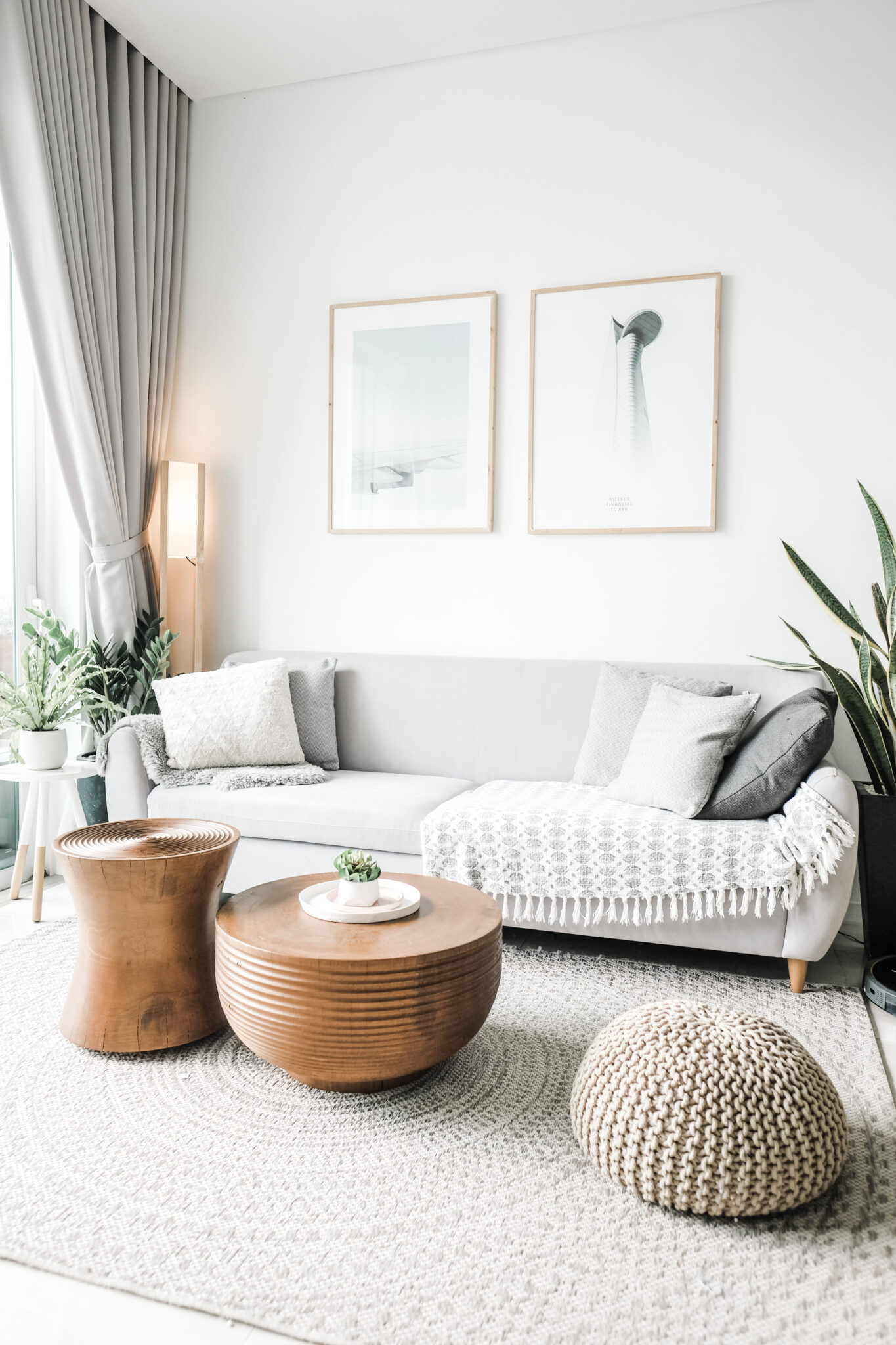 A beautiful neutral living room is shown, this article covers how to make a small living room feel spacious.