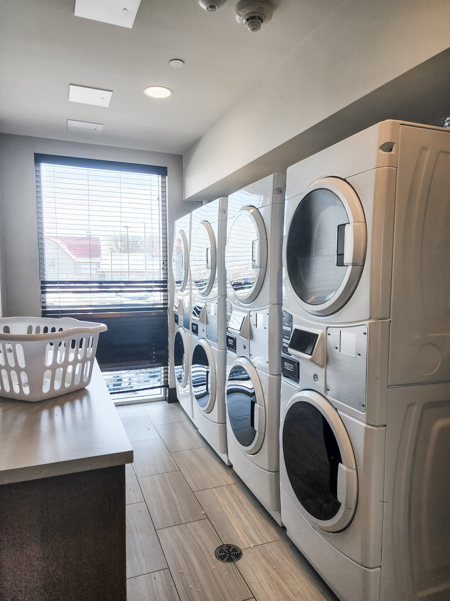 Guest laundry services shows 4 stacks of modern washer and dryers.