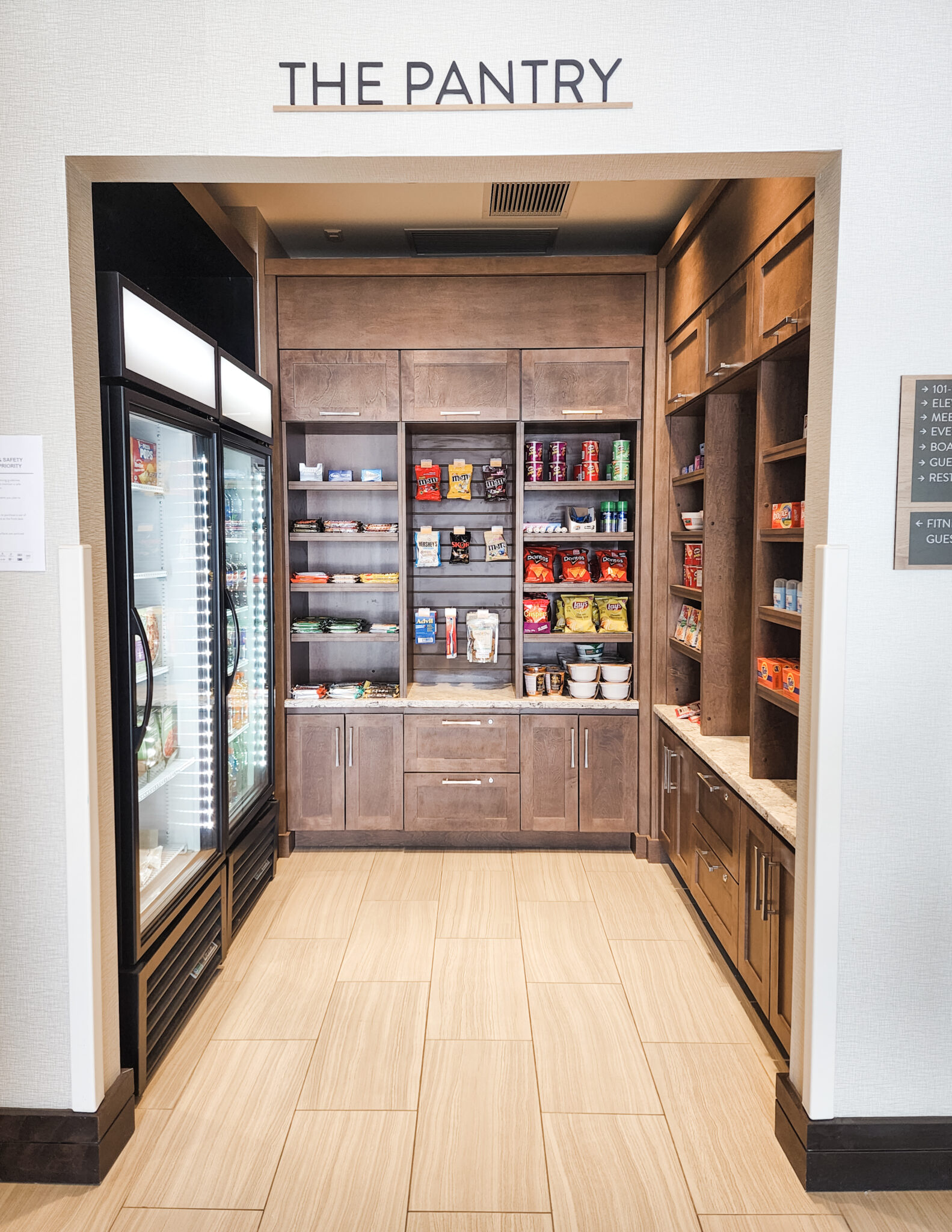 A fully stocked pantry with drinks, snacks, and frozen meals. 
