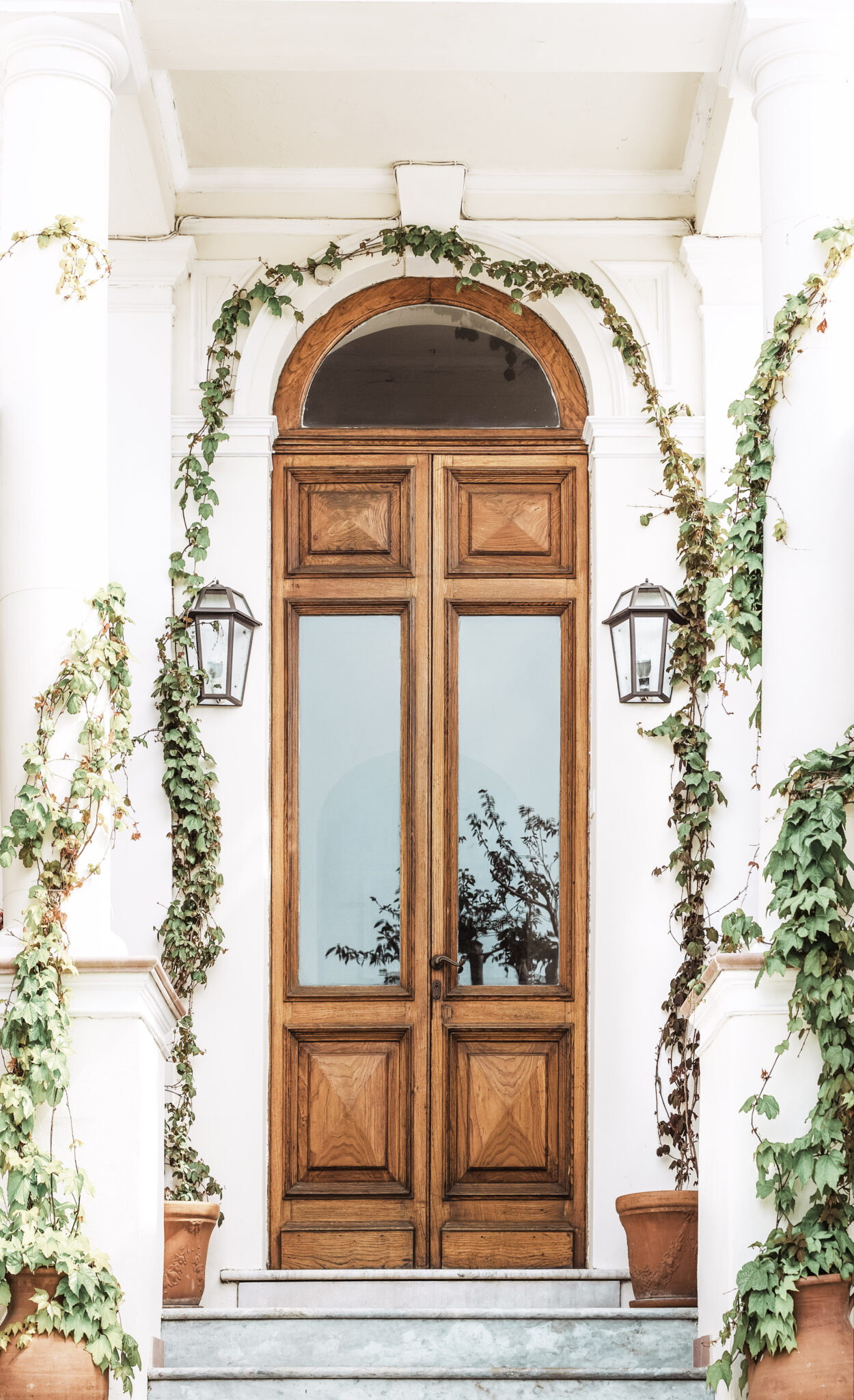 A beautiful and neutral doorway and exterior of a home. This article covers how to update your home's exterior.