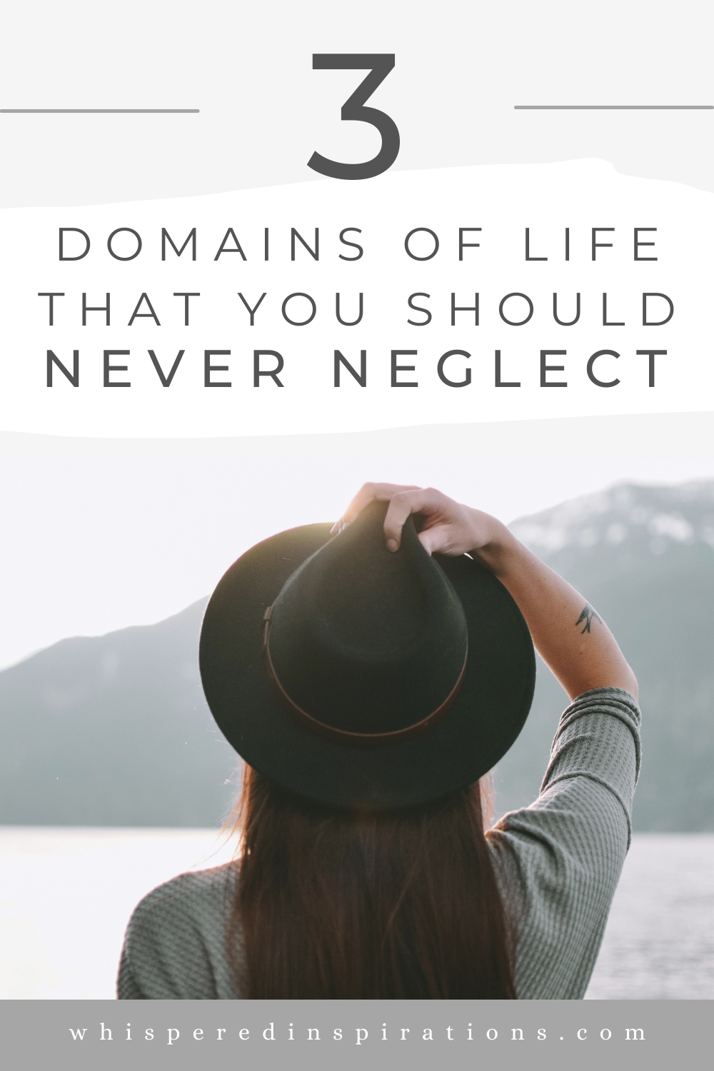 A brunette woman faces away from the camera towards a mountain scape and holds her fedora hat with one hand. This article covers domains in your life that you should never neglect.