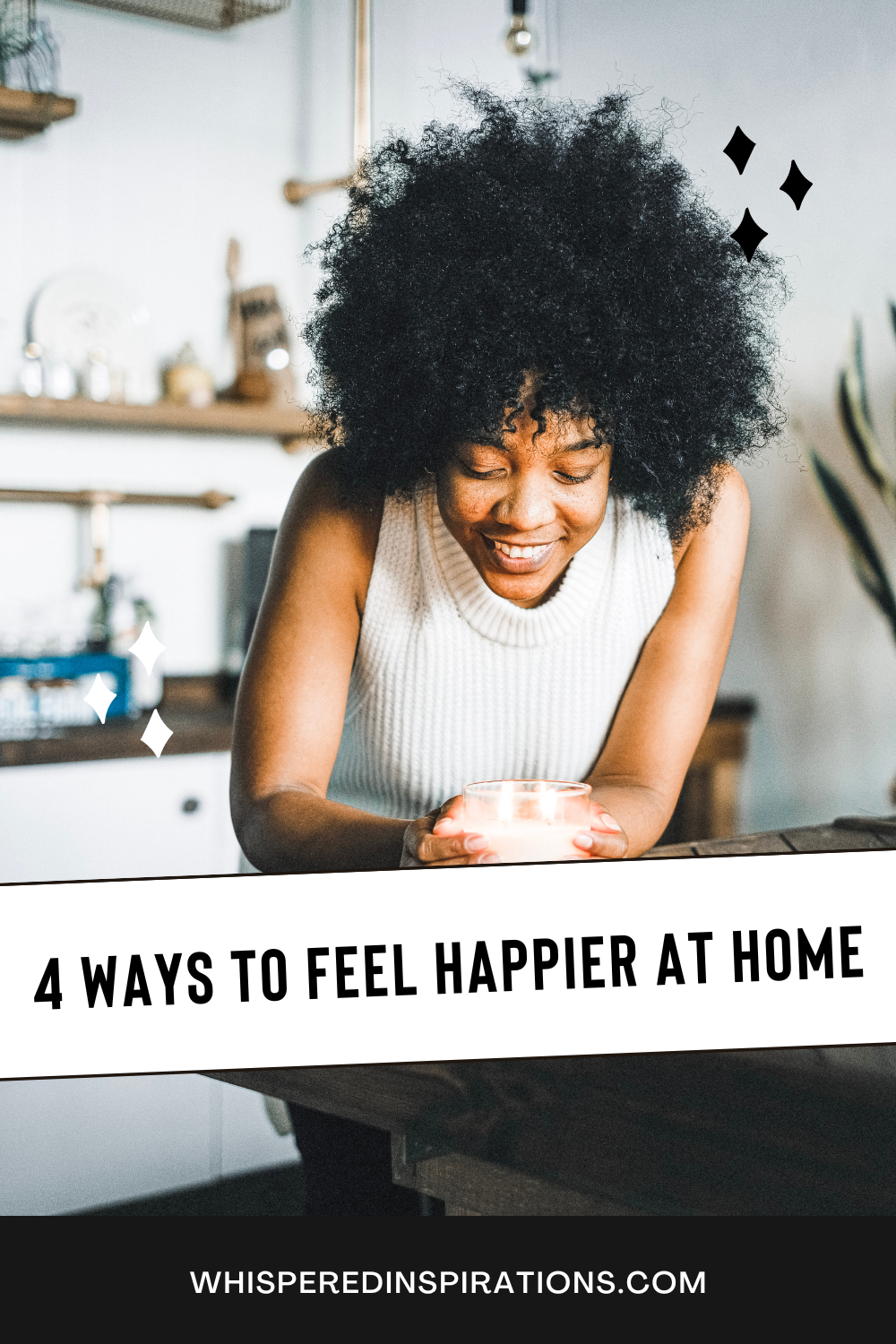 Woman holds a lit candle in the kitchen table. She smiles and is happy. This article covers ways to feel happier in your home.