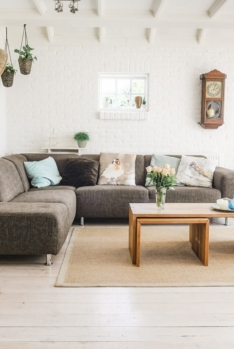 A beautiful, boho, living room is shown in neutral colors. This article covers how to revamp your home with these 2022 trends.