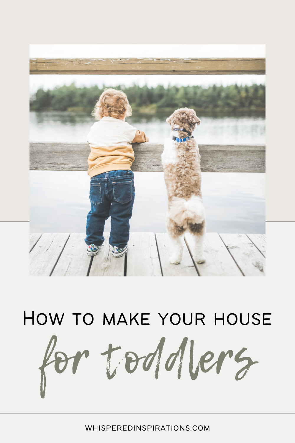 A curly-haired toddler and a Goldendoodle stand on a deck by a lake, back facing the camera. They look out to the lake together. This article covers how to make your house safer for toddlers.