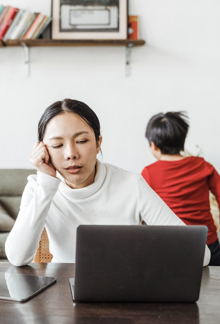 Woman is frustrating working at home with her child running around. This article covers how to keep your kids entertained as a remote worker.